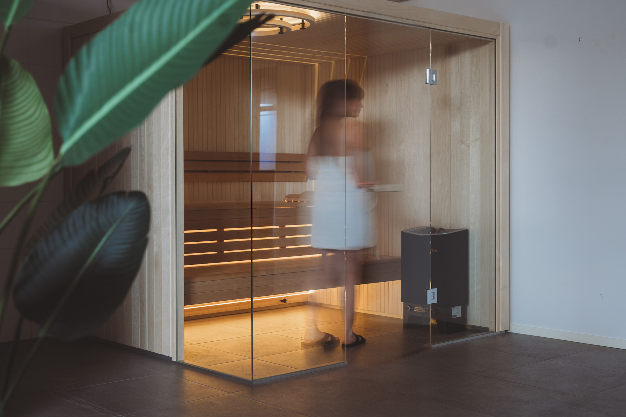  A woman in a Harmony sauna room